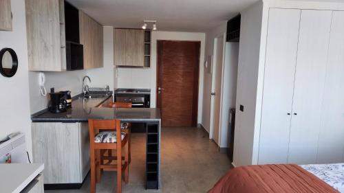 a kitchen with a sink and a counter top at Departamento Centro de Valdivia, Caupolican in Valdivia