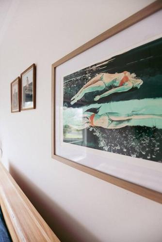 a picture hanging on a wall in a room at Bluey in Warrnambool