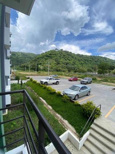a parking lot with cars parked in a parking lot at Apartamento e109 in Guatemala