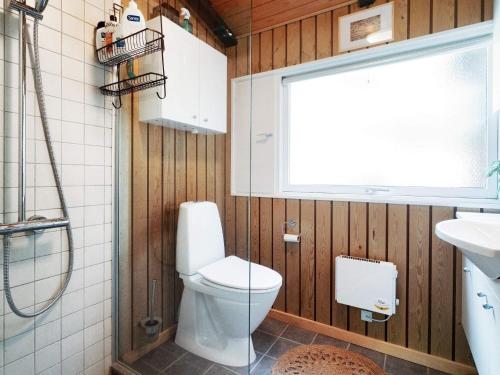 a bathroom with a toilet and a sink at 5 person holiday home in Frederiksværk-By Traum in Frederiksværk