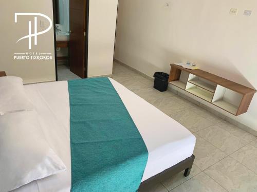 Postel nebo postele na pokoji v ubytování Hotel Puerto Tixkokob