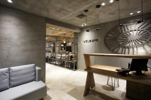 a waiting room with a desk and a computer at Rigas Boutique Hotel & Spa in Afitos