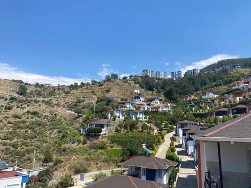 a view of a village with houses on a hill at Turkish riviera sea view detached villa in Gazipasa