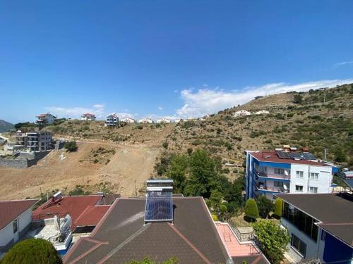 a view of a city with a building and a hill at Turkish riviera sea view detached villa in Gazipasa