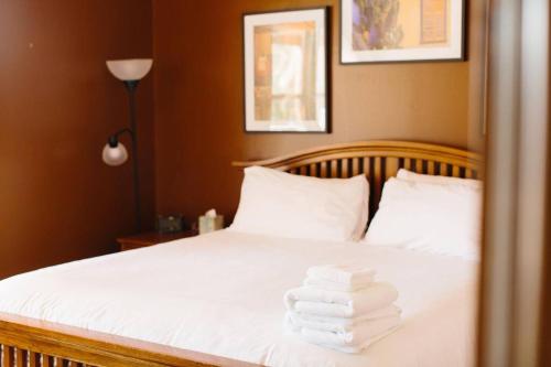 a bed with towels stacked on top of it at Sprawling Arizona Oasis w/ Dream Backyard in Anthem