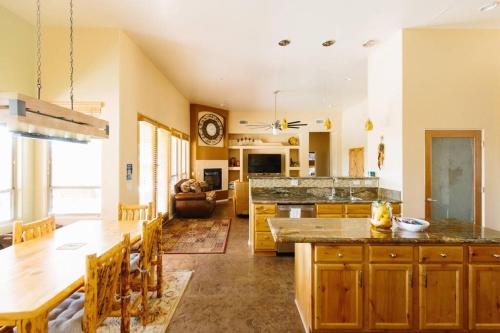 a large kitchen with a table and a dining room at Sprawling Arizona Oasis w/ Dream Backyard in Anthem