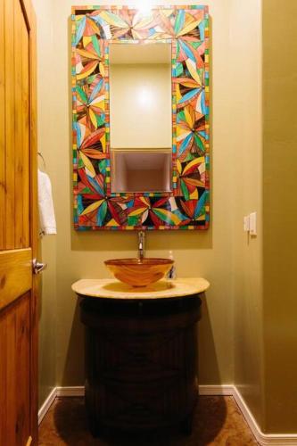a bathroom with a sink and a mirror at Sprawling Arizona Oasis w/ Dream Backyard in Anthem