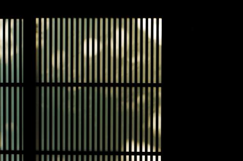 a close up of a window with a view of a building at hotori in Kyoto
