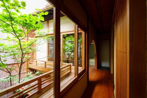 a hallway of a house with a window at hotori in Kyoto