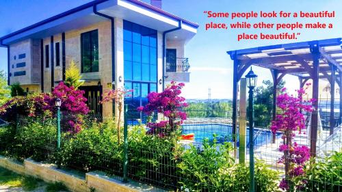 some people look for a balcony place while other people make a place beautiful at Villa15 Lodge, Five-Star Stay 5BD 5-5BA Beach Access Villa with Pool , Gym, Sauna, Alfresco Dining & Garden in Manavgat