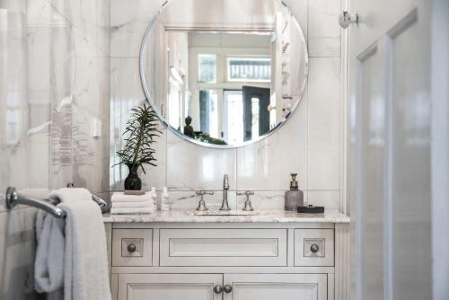 a bathroom with a sink and a mirror at Birch House in Daylesford