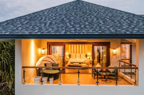 a house with a balcony with a bedroom at Hideaway Beach Resort & Spa, FREE SHARED CHARTER FLIGHT for two on stays of 7 or more nights from September 2025 until 23rd December 2026 in Dhidhdhoo