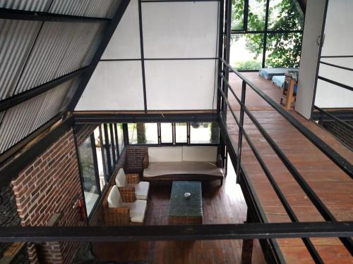 an overhead view of a living room in a house at Riverside cabin in Pengalongan