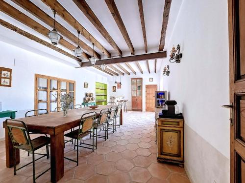 a dining room with a long table and chairs at Casa Rodriguillo in Pinoso