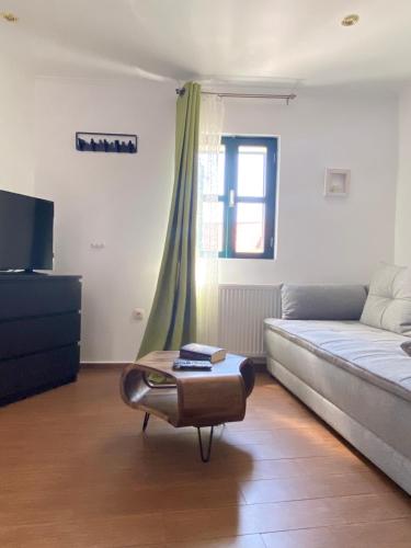 a living room with a bed and a coffee table at Tower House Vodice in Vodice