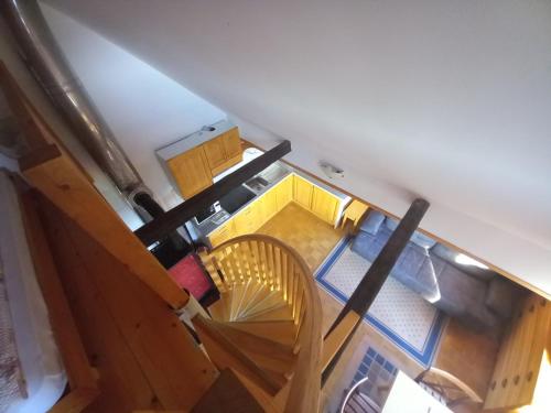 an overhead view of a kitchen and a dining room at Apartments Tubej in Bohinj