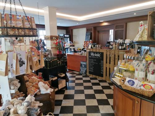 a store filled with lots of stuffed animals in a store at Pension Sanddorn mit Café Carlssons in Binz