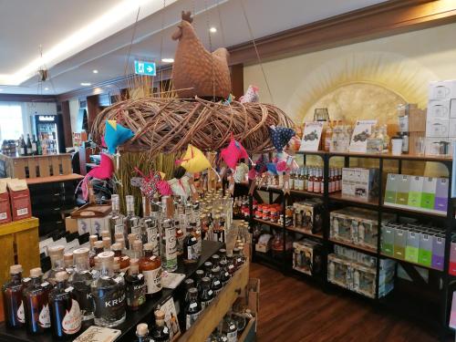 a store filled with lots of bottles of alcohol at Pension Sanddorn mit Café Carlssons in Binz
