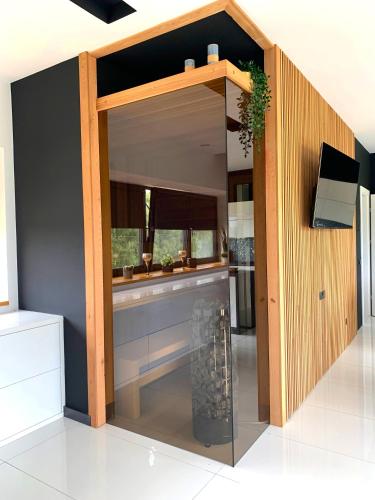 a kitchen with a large window in a room at Apartament 106 in Andrychów