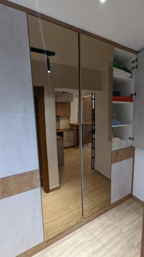 a view of a living room with a sliding glass door at Apartman ANA in Žabljak