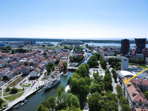 an aerial view of a city with a river at Great View Meridianas Apartment in Klaipėda