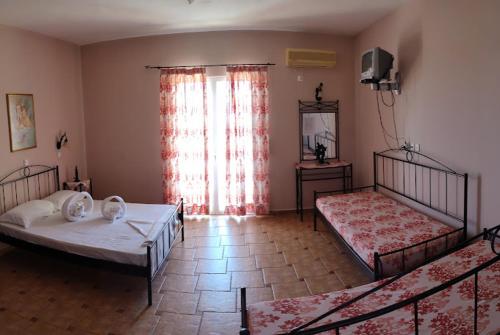 Voodi või voodid majutusasutuse Hotel Takis toas