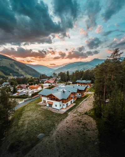 an aerial view of a village with houses at Les Ciases Chalets Dolomites in San Vigilio Di Marebbe