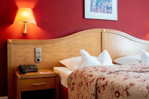 Postel nebo postele na pokoji v ubytování Hotel Baseler Hof