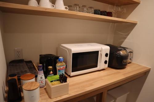 Dapur atau dapur kecil di Aki's Apartments Madarao