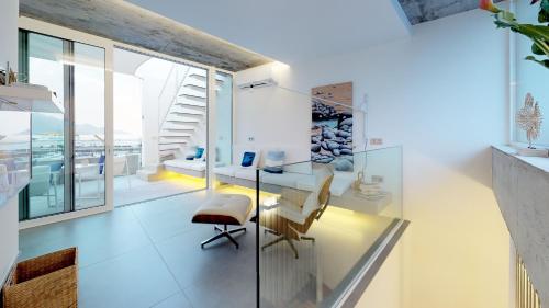 a dining room with a glass table and chairs at Casa de Las Nieves by Airnest in Puerto de las Nieves