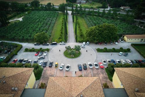 an aerial view of a parking lot with cars at Delfina Palace Hotel in Foligno