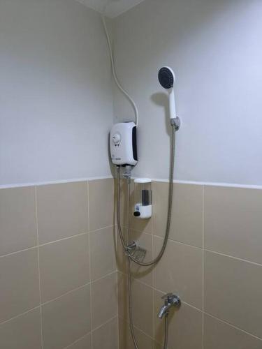 a shower in a bathroom with a shower head at ZSL Elegant Condo LOOP 1 Bedroom Tower 1 in Cagayan de Oro