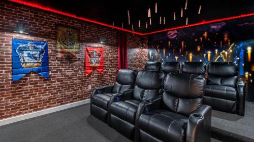 a room with leather chairs against a brick wall at 1249 Challenge in Davenport
