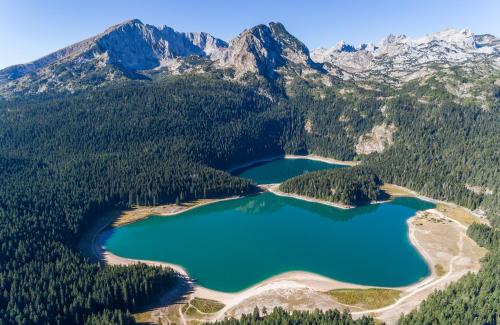 an aerial view of two lakes in the mountains at Apartman ANA in Žabljak