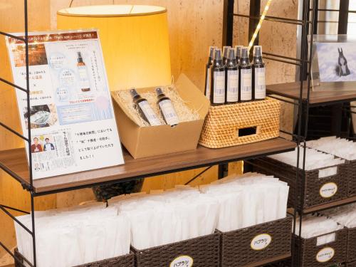 a shelf with boxes of products on it at Fukui Hotel in Obihiro