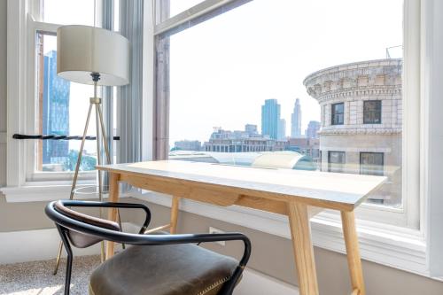 a desk with a chair in front of a window at Loop 2BR w Gym Doorman nr L Parks CHI-318 in Chicago