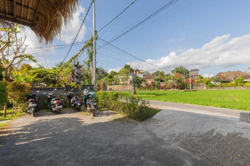 a group of motorcycles parked on the side of a road at NILUH Private Villas Ubud in Ubud