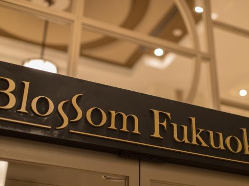 a black and gold sign that reads bloson buffet at JR Kyushu Hotel Blossom Fukuoka in Fukuoka