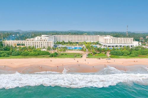 an aerial view of a beach and buildings at Riu Sri Lanka All Inclusive in Bentota