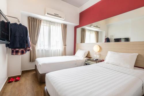 Postelja oz. postelje v sobi nastanitve Monoloog Hotel Makassar