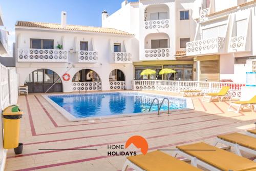 a villa with a swimming pool in a resort at #007 Foxy W by Home Holidays in Albufeira