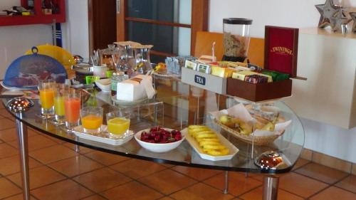 a buffet of breakfast foods and drinks on a table at ai18diamanti in Saludecio