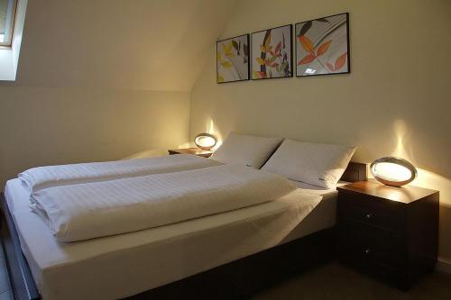 Un pat sau paturi într-o cameră la Apartament 25 Panorama Gór