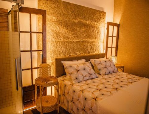 a bedroom with a large bed in a room at Seixomil - Casa de Campo Boutique Design in Celorico de Basto