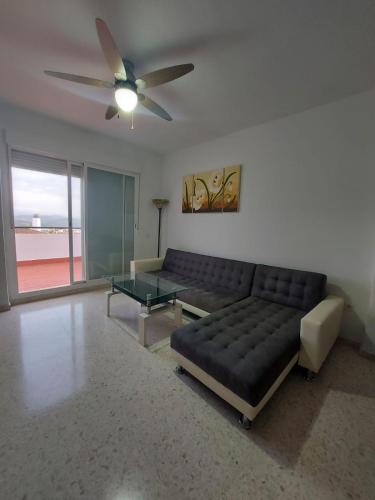 a living room with a couch and a table at El Mirador in Prado del Rey