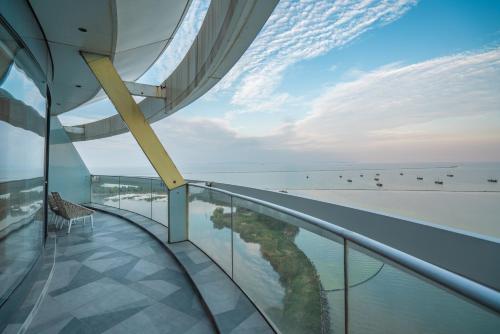 a view of the ocean from a building balcony at Sheraton Huzhou Taihu Lake Hot Spring Resort & Spa in Huzhou