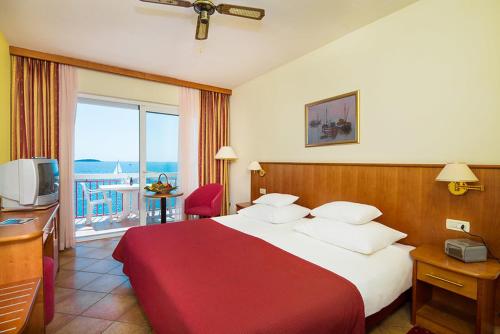 Postel nebo postele na pokoji v ubytování Hotel Zora