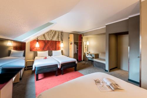 Postel nebo postele na pokoji v ubytování ibis Hotel Regensburg City