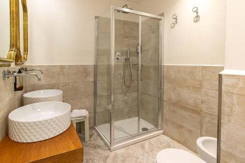 a bathroom with a shower and a sink at Hotel Machiavelli Palace in Florence
