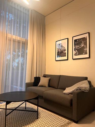 a living room with a couch and a table at Chalet Park by Maier Höchst in Höchst